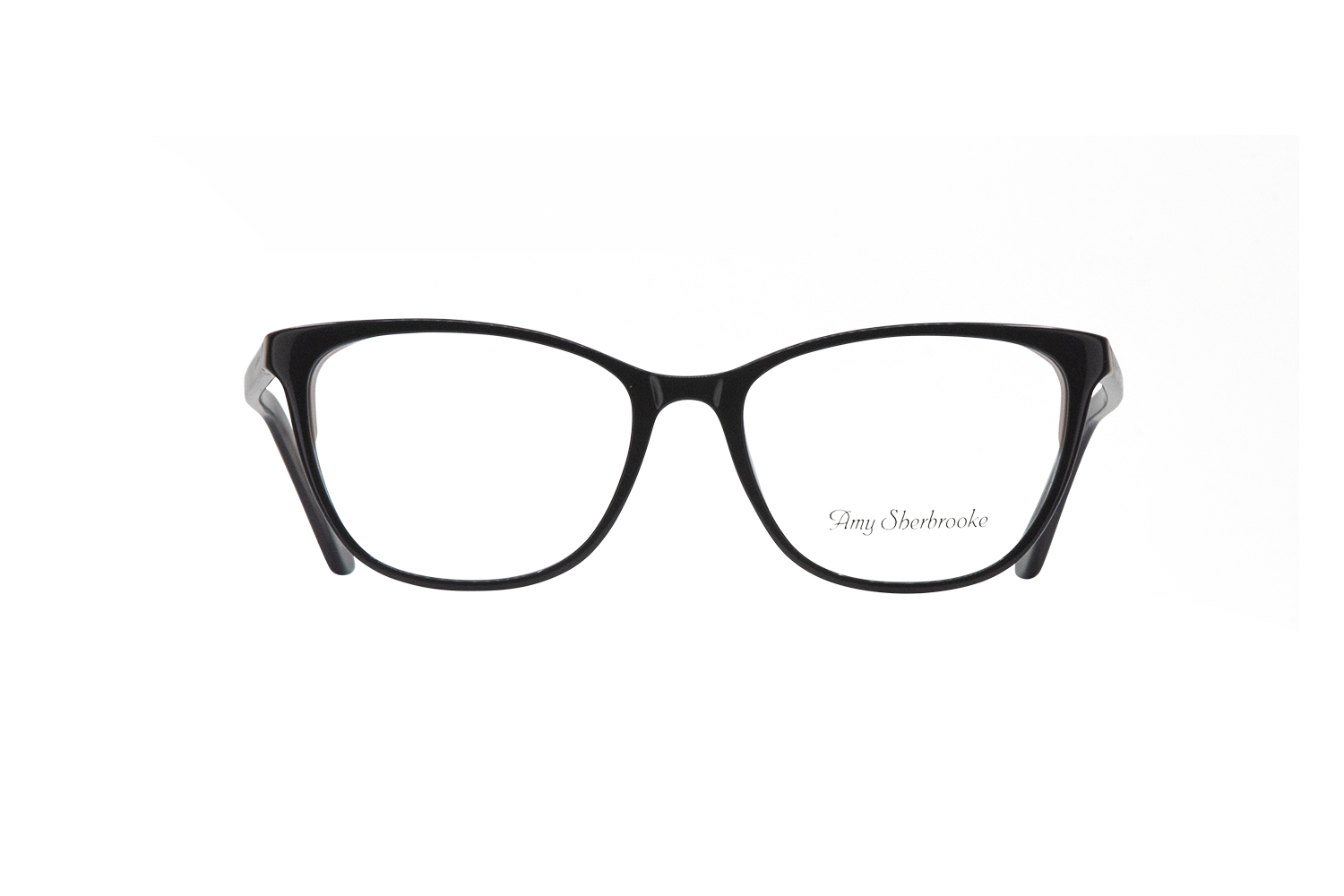 Black rectangular eyeglasses with a dark frame, shown against a gray geometric backdrop; subtle signature text appears on the right lens.
