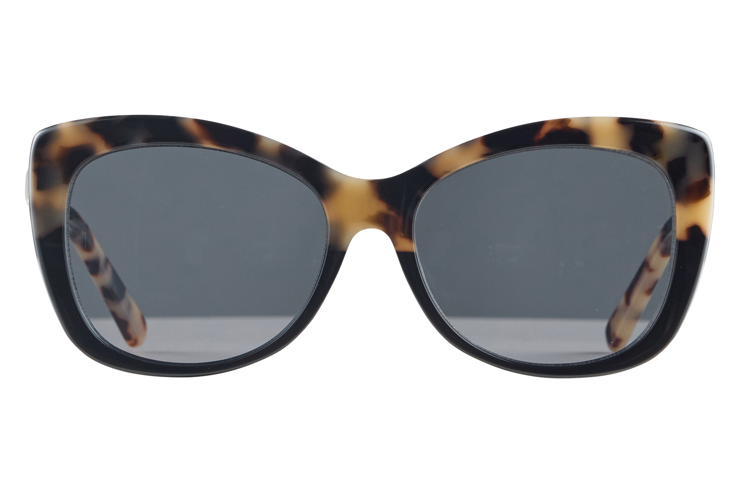Oversized tortoiseshell sunglasses with dark lenses, front view.