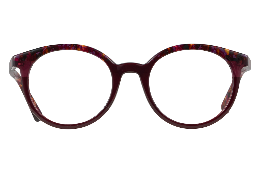 Red tortoiseshell eyeglasses with large round frames facing forward on a light surface, close‑up view