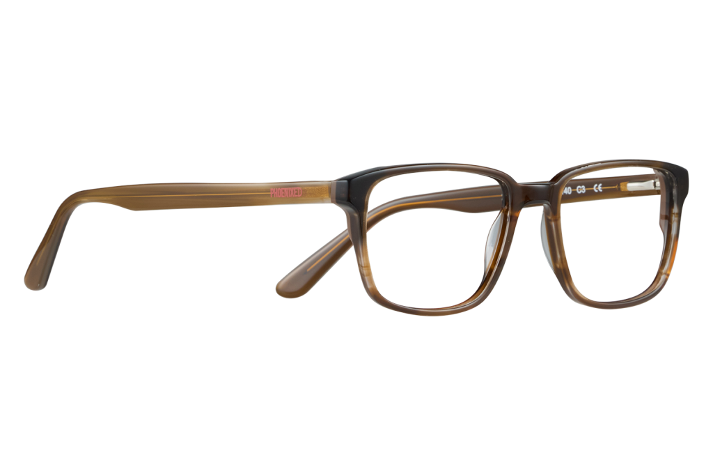 Brown tortoiseshell rectangular eyeglasses shown in a side view on a light surface, emphasizing the frames and temples.