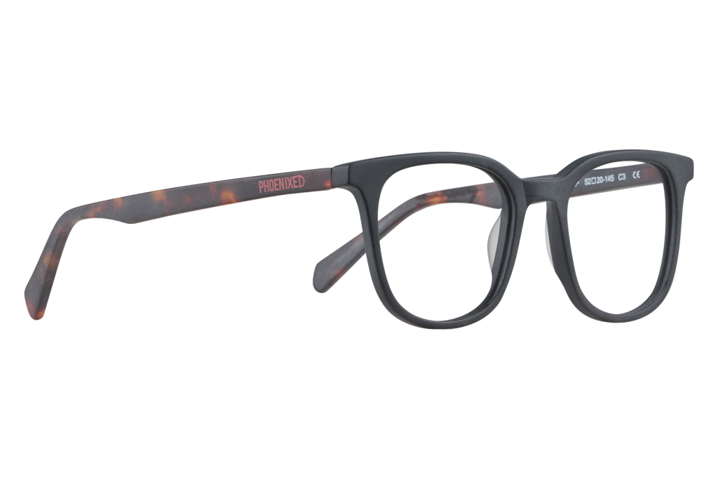 Side view of black plastic eyeglasses with tortoiseshell temples, brand Phoenixed visible on the arm