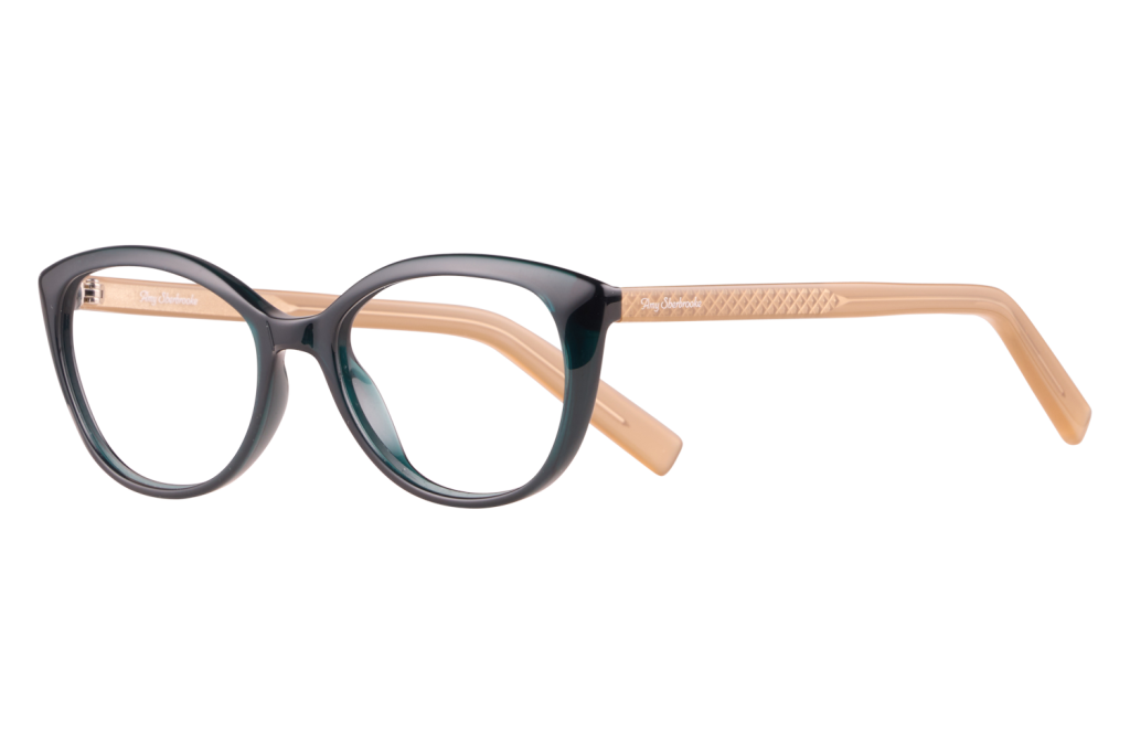Two-tone cat-eye eyeglasses with dark front frames and light tan temples, shown from a side profile.