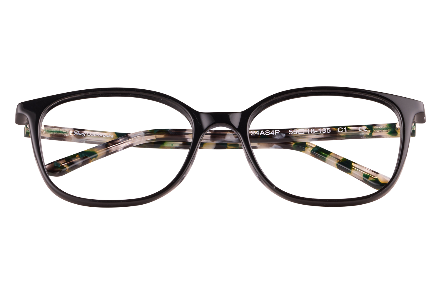 Black plastic eyeglasses with tortoiseshell-patterned temples resting on a clear block.
