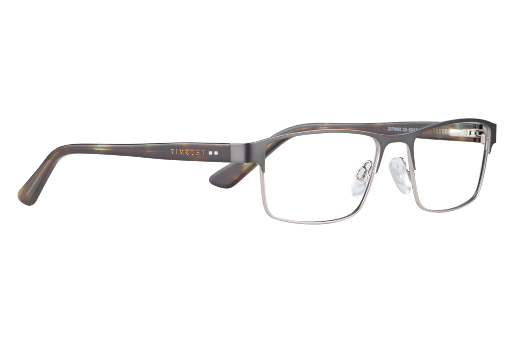 Rectangular metal eyeglasses with tortoiseshell arms resting on a light surface; 'TIMOTHY' logo on the temple(s).