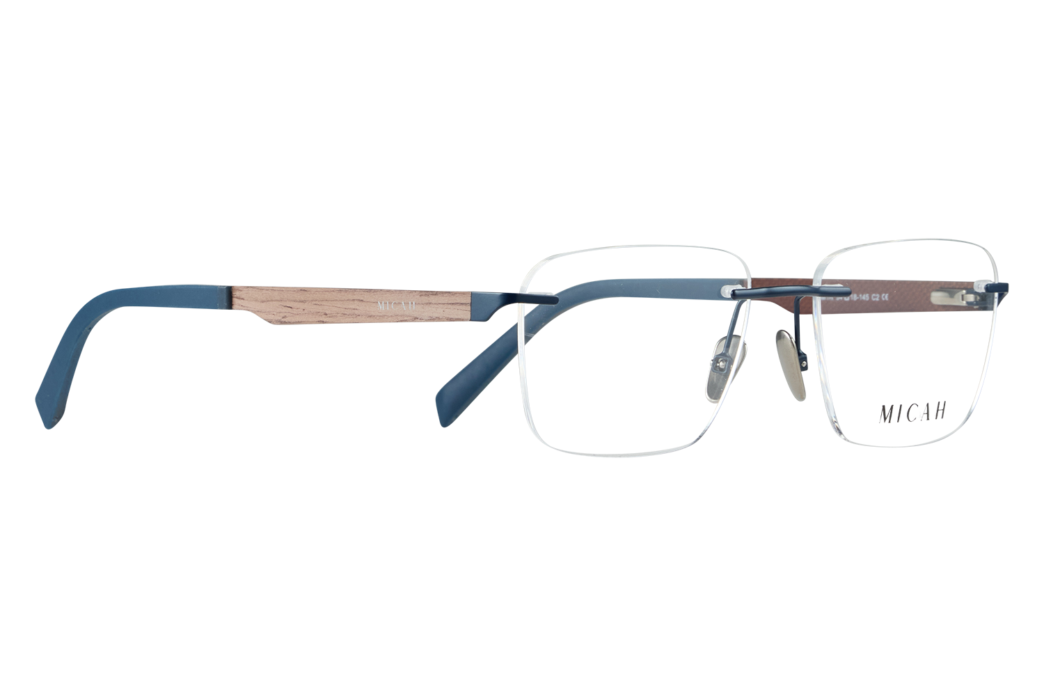 Close-up of blue-framed eyeglasses with wooden arms on a light desk; MICAH logo visible on the lens side.
