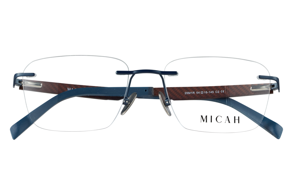 Rimless eyeglasses with blue temples and a slim blue bridge, displayed on clear blocks; brand Micah visible.