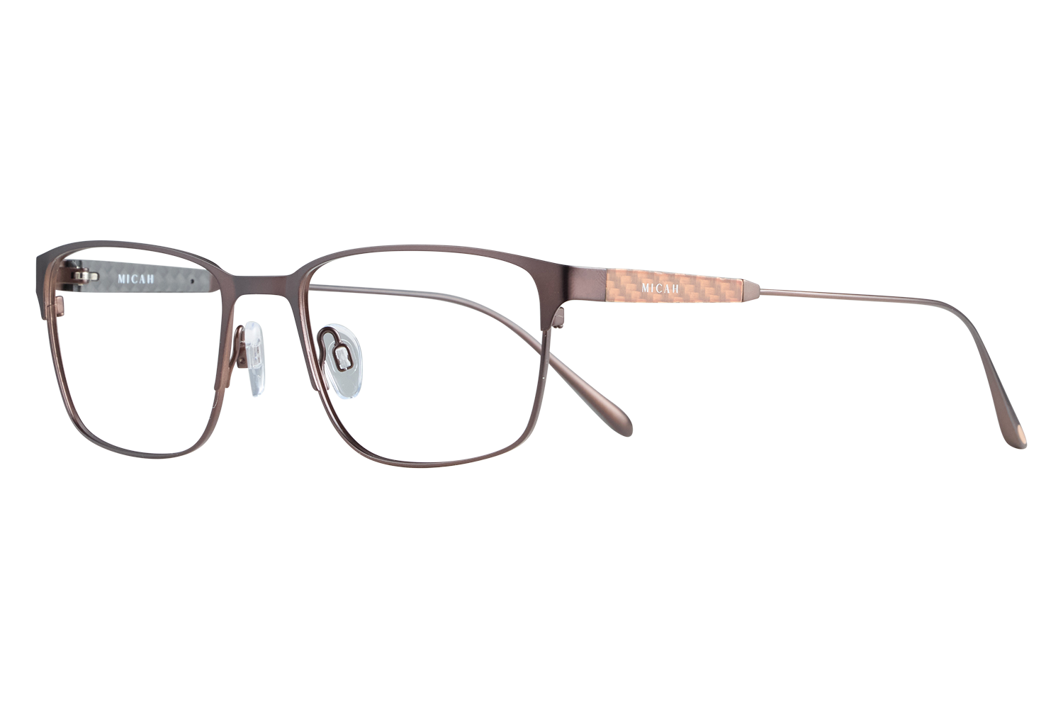Brown rectangular eyeglasses with clear nose pads and copper-patterned temples resting on a gray background, brand Micah visible on the arm.