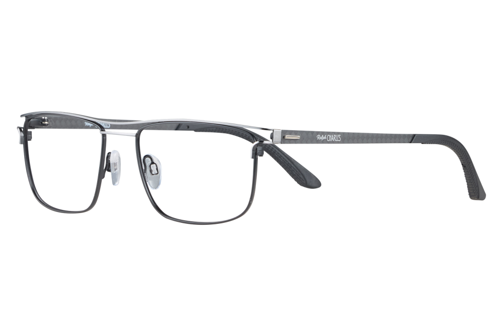 Close-up of black eyeglasses with metal frame and clear nose pads, brand Ralph Charles visible on the temple against a gray background.