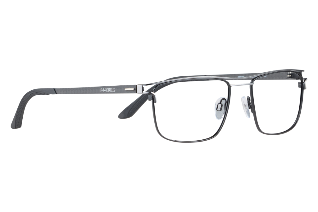 Close-up of black metal-frame eyeglasses with clear nose pads, brand Ralph Charles visible on the temple.