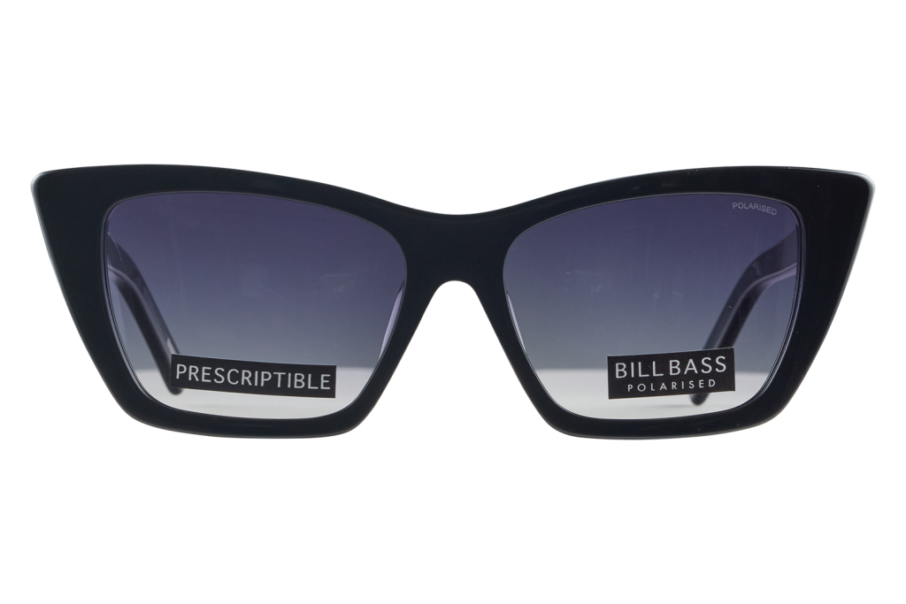 Black oversized cat-eye sunglasses with gradient lenses and brand stickers that read 'PRESCRIPTIBLE' and 'BILLBASS POLARISED'