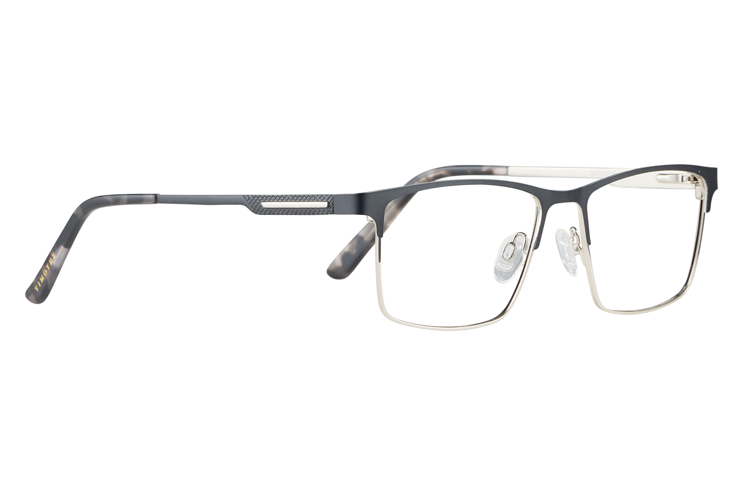 Black rectangular eyeglasses with a dark frame lying on a light surface.