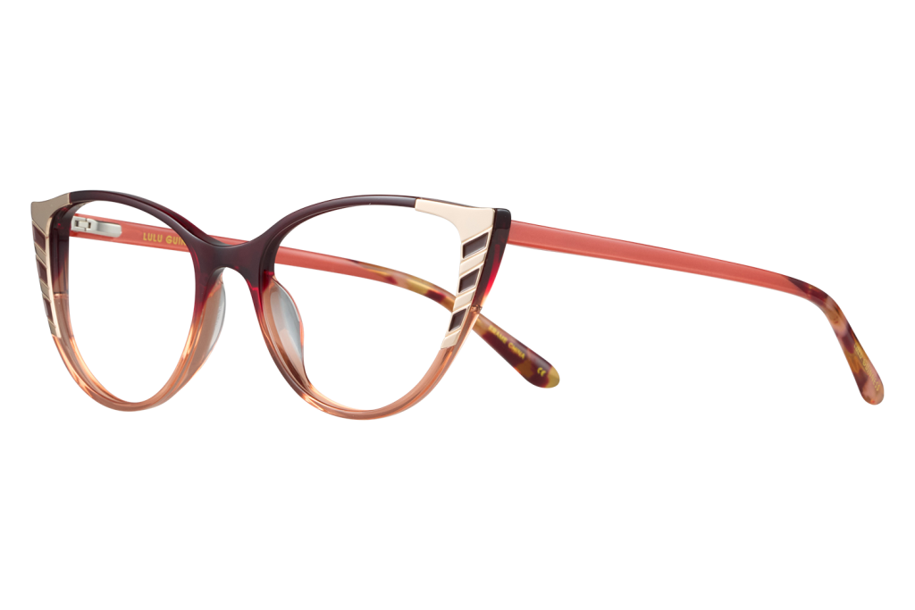Fashionable translucent pink-to-peach eyeglasses with rounded cat-eye frames and amber temples, shown in profile