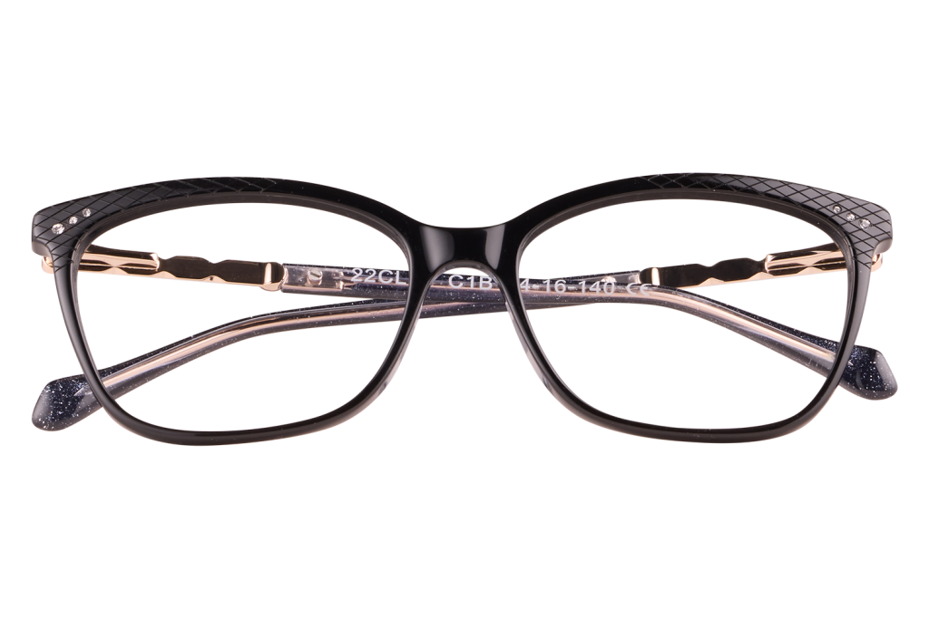 Black rectangular eyeglasses with gold-tone temples, resting on a clear display block against a pale background (product photo).
