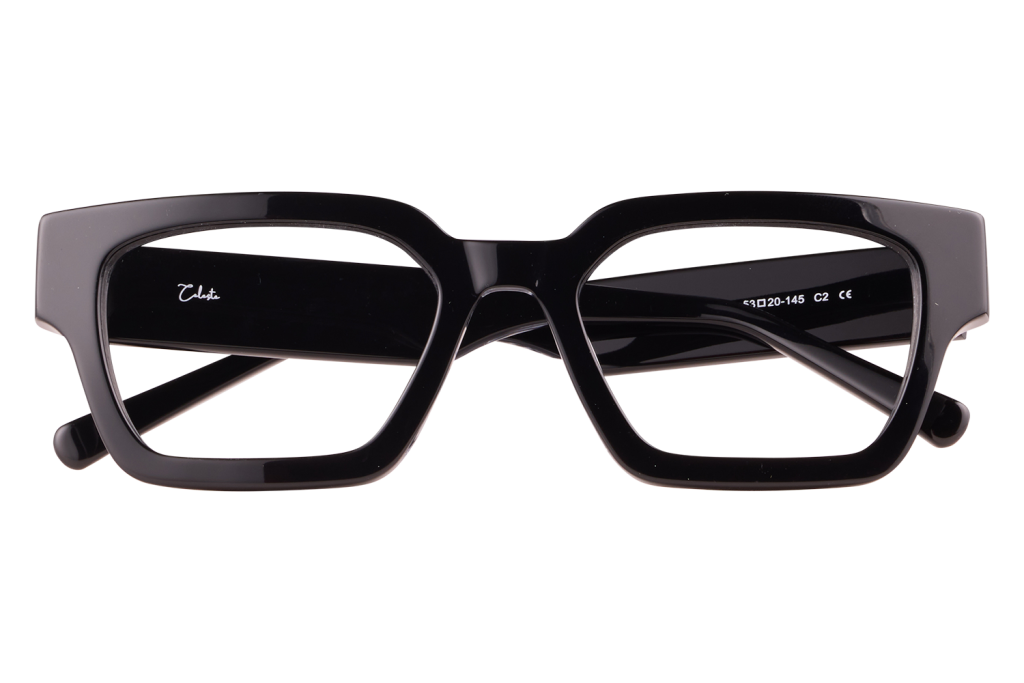 Black rectangular eyeglasses with a thick glossy frame resting on a small clear stand on a light background, brand visible on the arm.