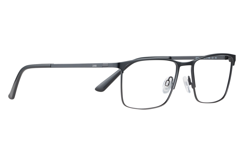 Close-up of black rectangular eyeglasses with clear nose pads resting on a light surface; metal frame with subtle branding on the temple.