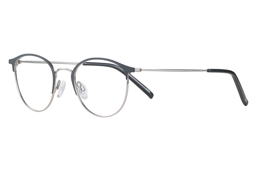 Pair of round metal-frame eyeglasses with adjustable nose pads resting on a light surface.