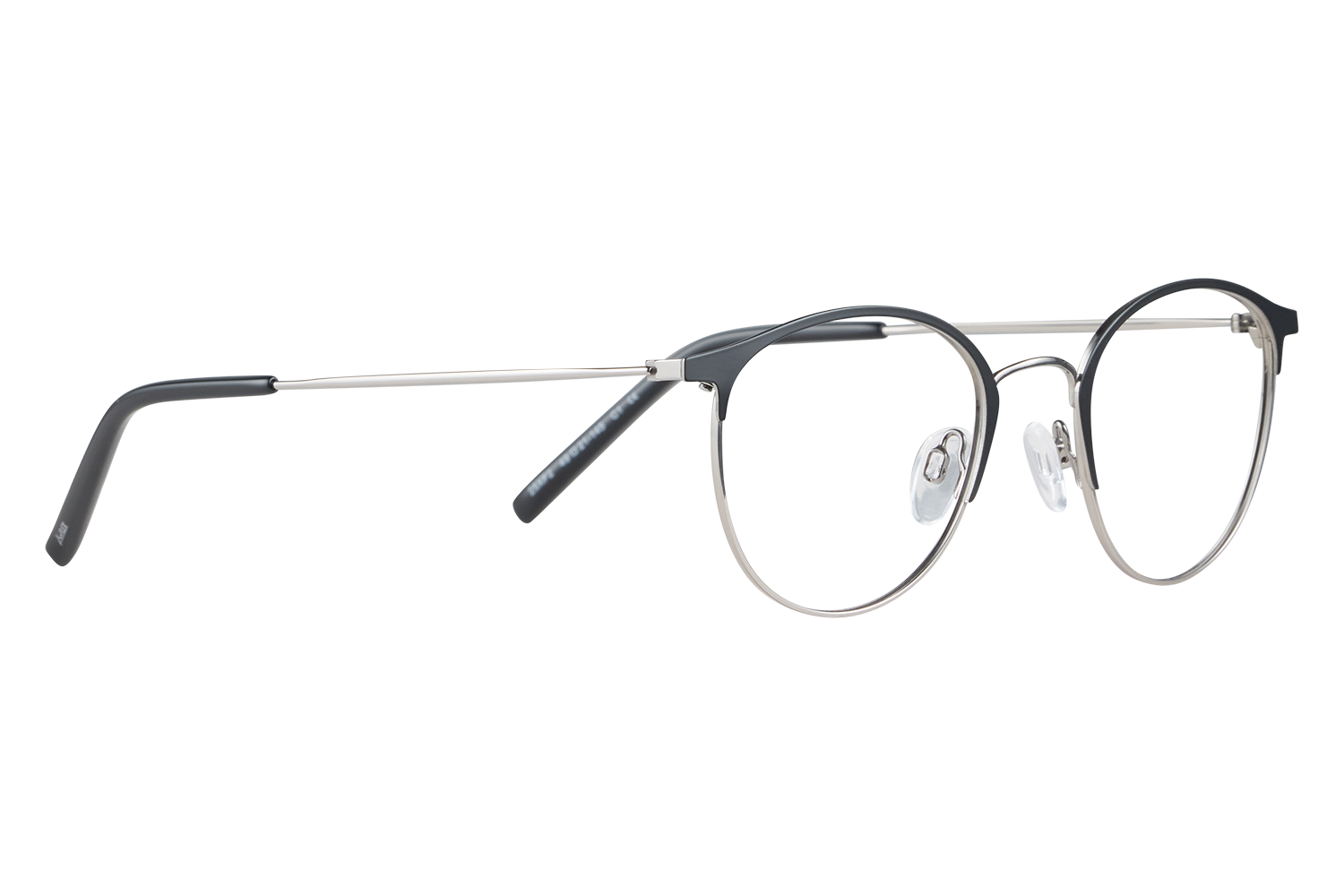A pair of round metal-framed eyeglasses with black temples resting on a pale surface, lenses clear.