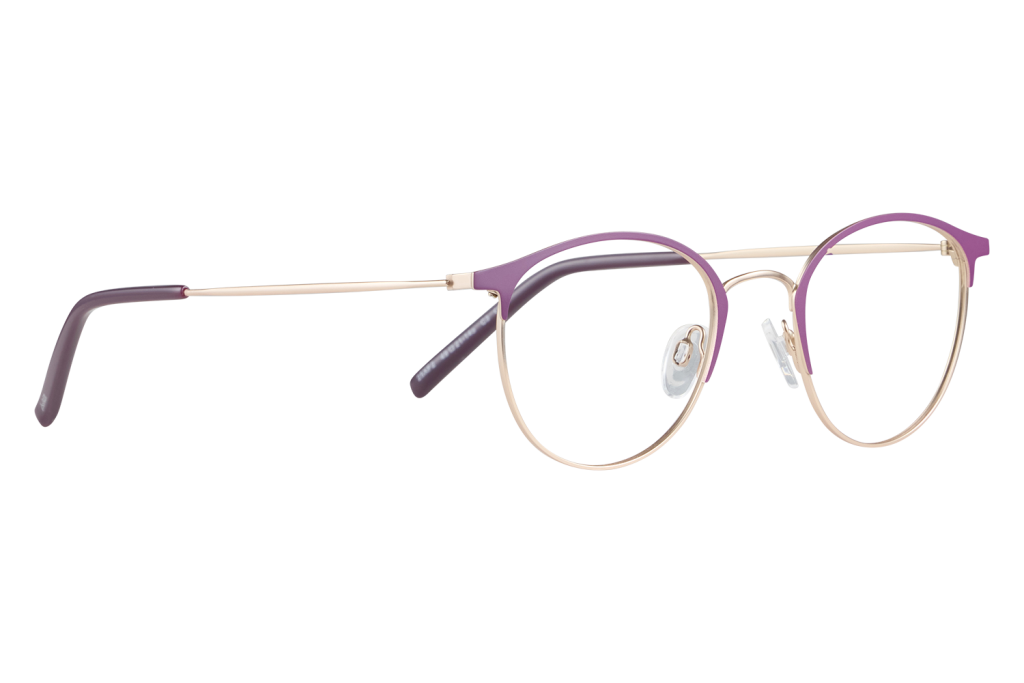 Purple-framed eyeglasses with gold rims and clear nose pads resting on a light surface against a gray backdrop