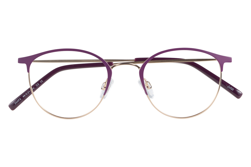 Purple-framed eyeglasses with gold wire rims resting on a clear glass block, front view