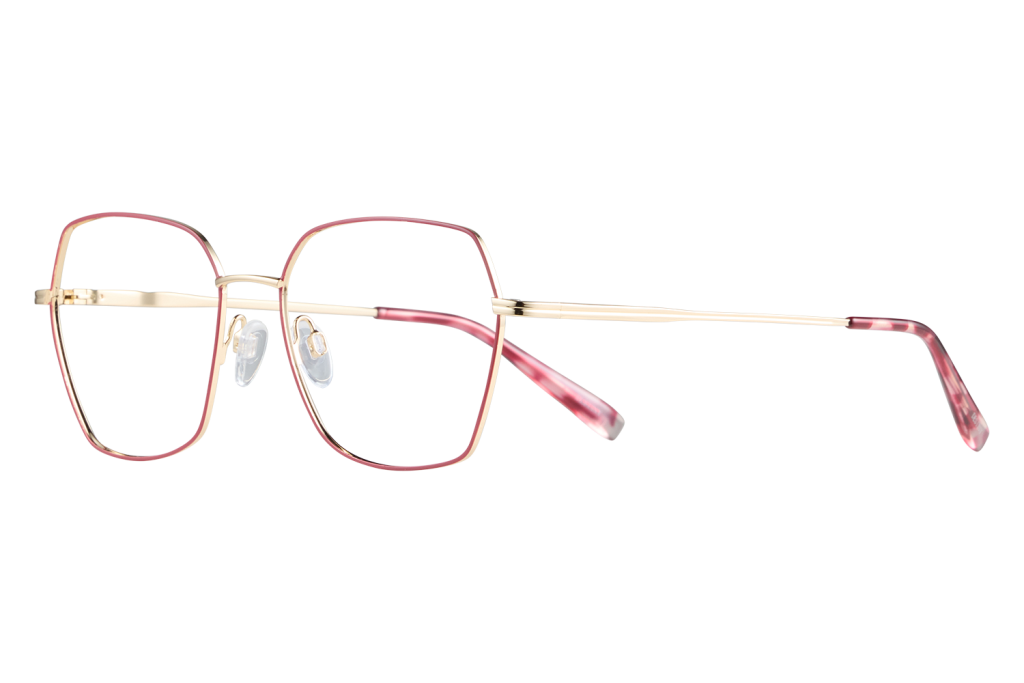 Pink-rimmed eyeglasses with gold temples resting on a light surface against a gray background