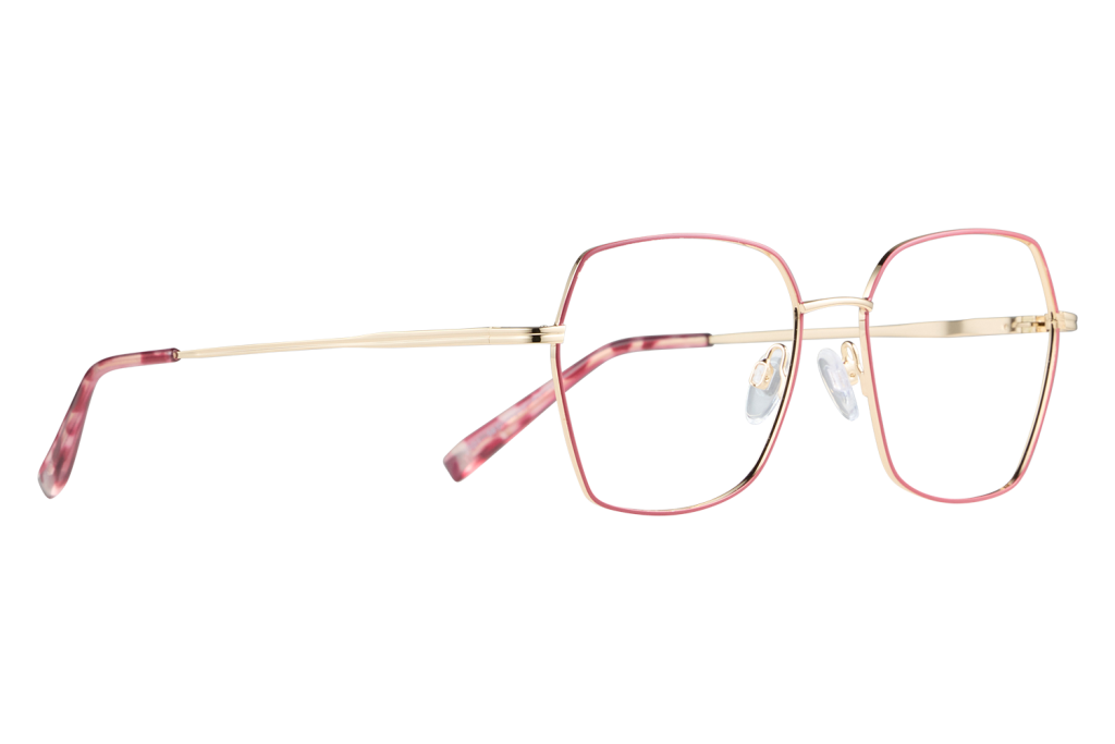 Gold-framed eyeglasses with pink rims and clear nose pads on a white surface to the right of center.
