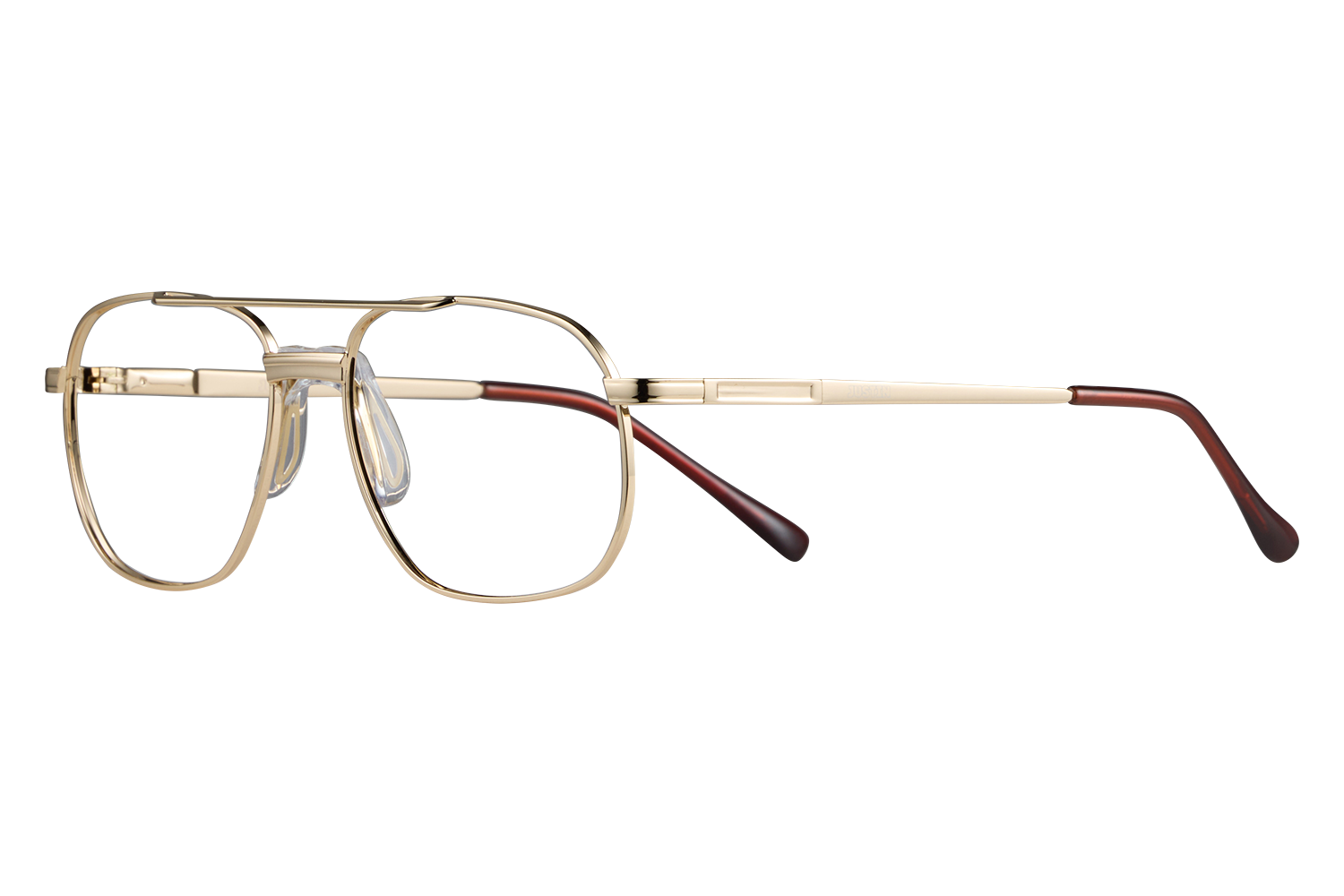 Gold metal eyeglasses with round rectangular lenses and red temple tips on a gray surface.