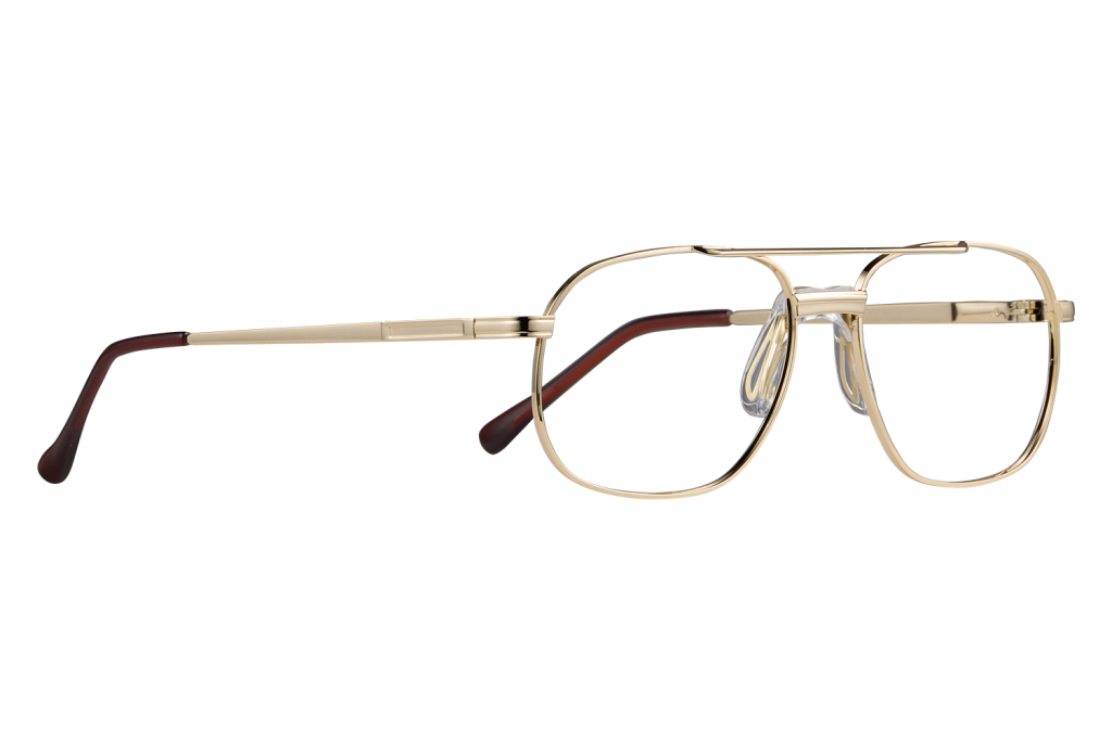 Gold metal eyeglasses with clear lenses and brown temple tips on a gray background, close-up on a flat surface, side view.