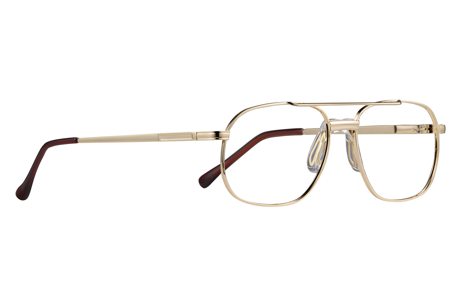 Gold metal eyeglasses with clear lenses and brown temple tips on a gray background, close-up on a flat surface, side view.