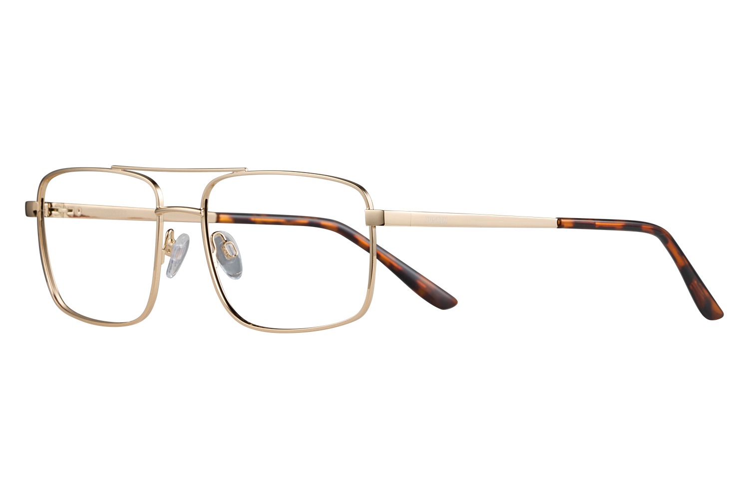 Gold metal eyeglasses with tortoiseshell temples laid on a gray surface.