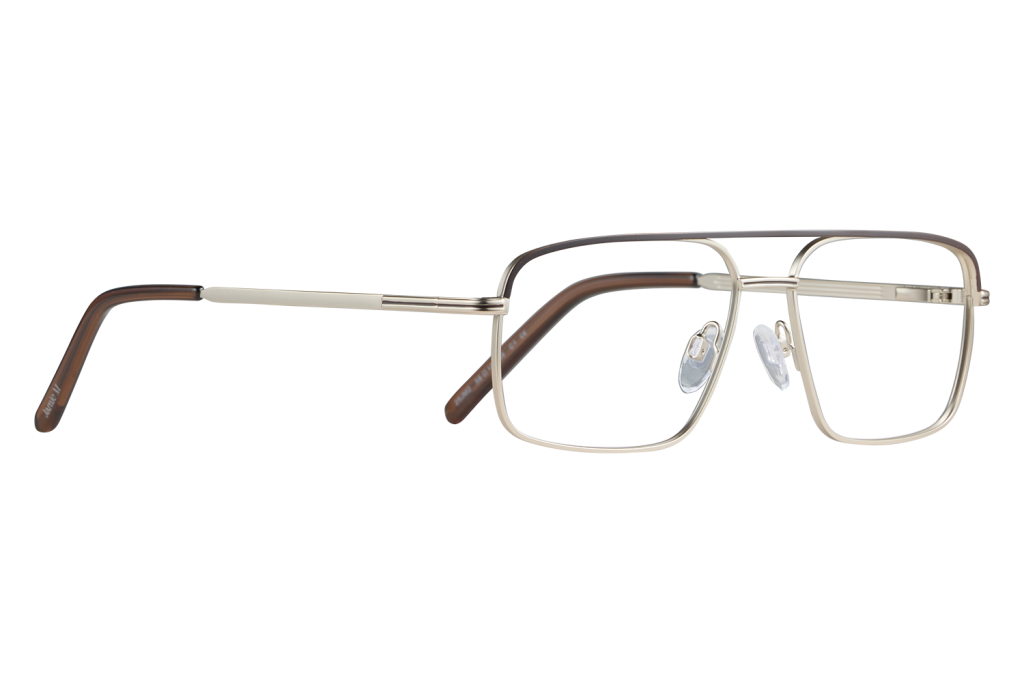 Pair of metal-rimmed glasses with beige and brown frame lying on a light surface against a gray background.