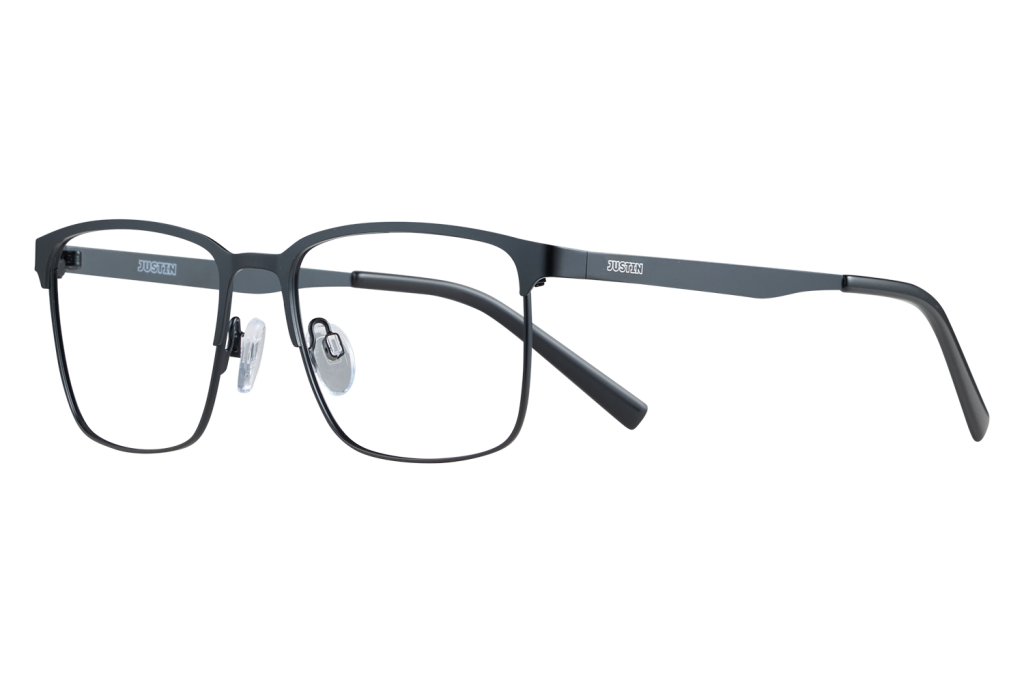 Dark gray rectangular eyeglasses with clear nose pads resting on a light surface, brand name ‘JUSTIN’ on the temples.
