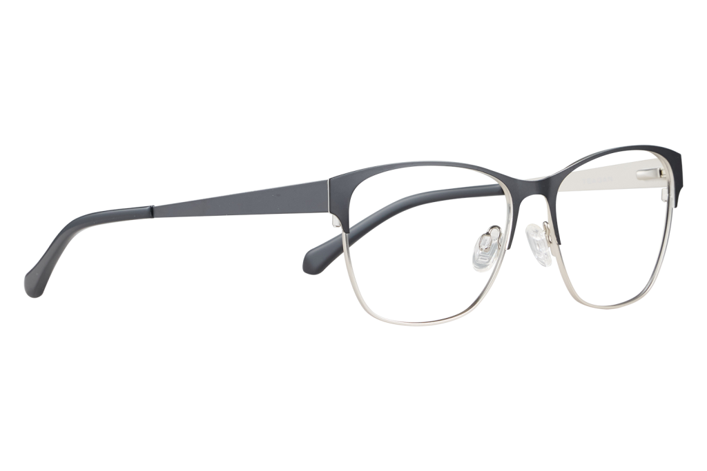 Close-up of black two-tone eyeglasses with clear lenses and nose pads on a light surface