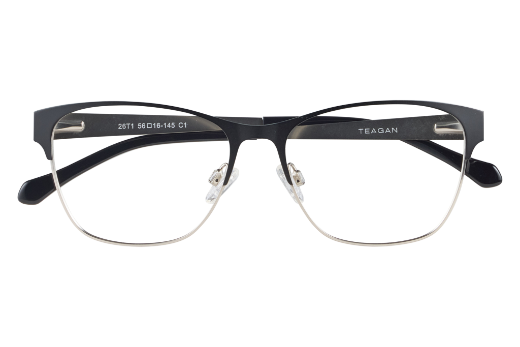 Black and silver half-rrim glasses with clear lenses resting on a display stand, brand Teagan visible on arm