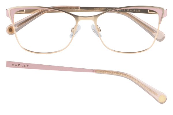 Pink-gold metal frame eyeglasses with pale pink temples, one temple detached showing ornate pattern beneath the frame.